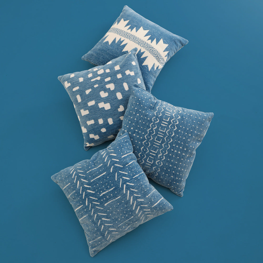 Woven pillow cover with geometric ethnic relief and textured tufting look