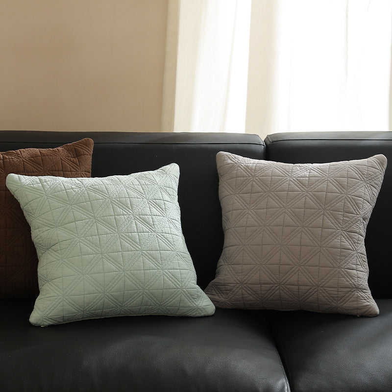 Square quilted decorative cushion made of cotton blend fabric with geometric cross quilted pattern