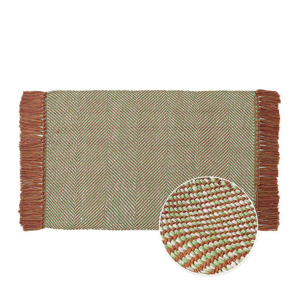 Woven table runner made of cotton blend with fine structure and herringbone look as well as decorative fringes