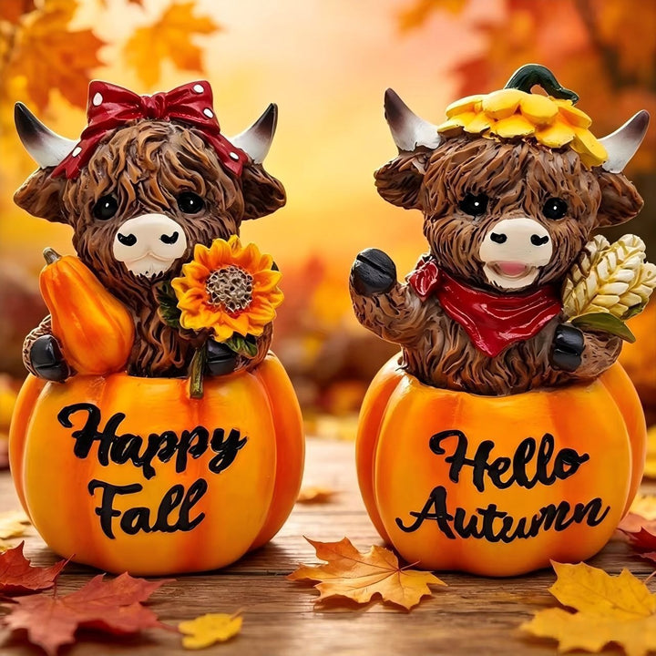 Funny decorative figure of a Highland cow in pumpkin costume