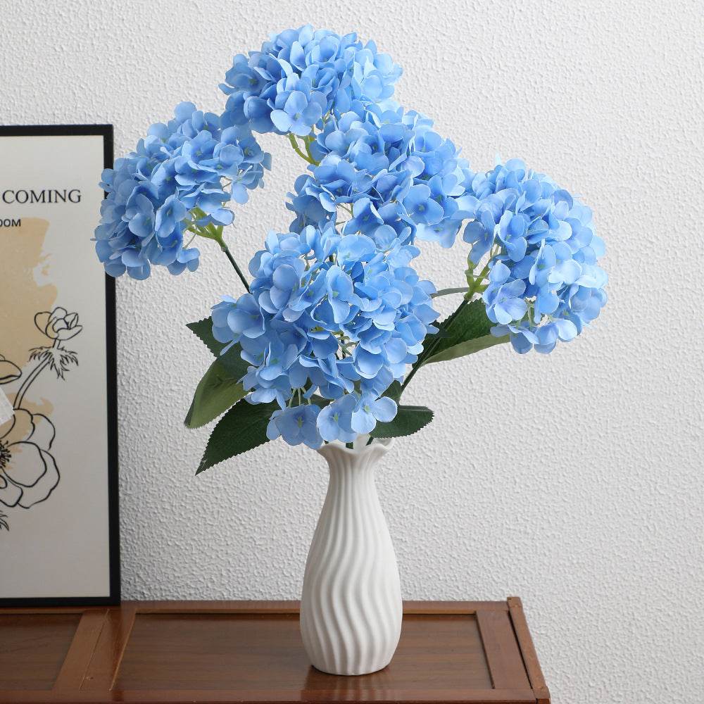 Decorative artificial flower arrangement