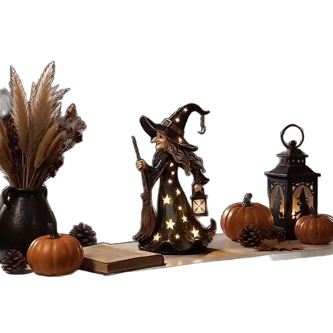 Decorative witch figure with broom