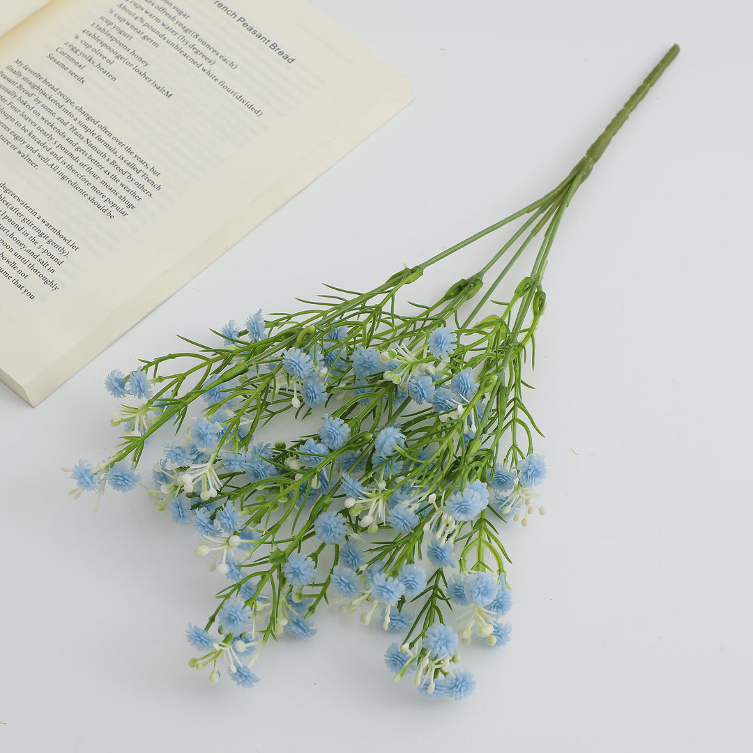 Decorative artificial flower branch with delicate purple flowers