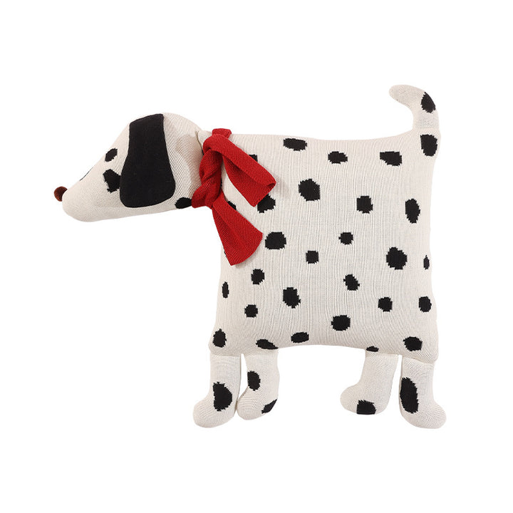 Decorative knitted cuddle pillow in the shape of a dog with a quilted body and bow detail
