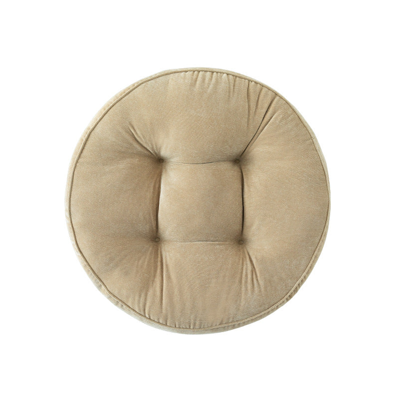 Round padded seat cushion with tufting and soft microfiber cover