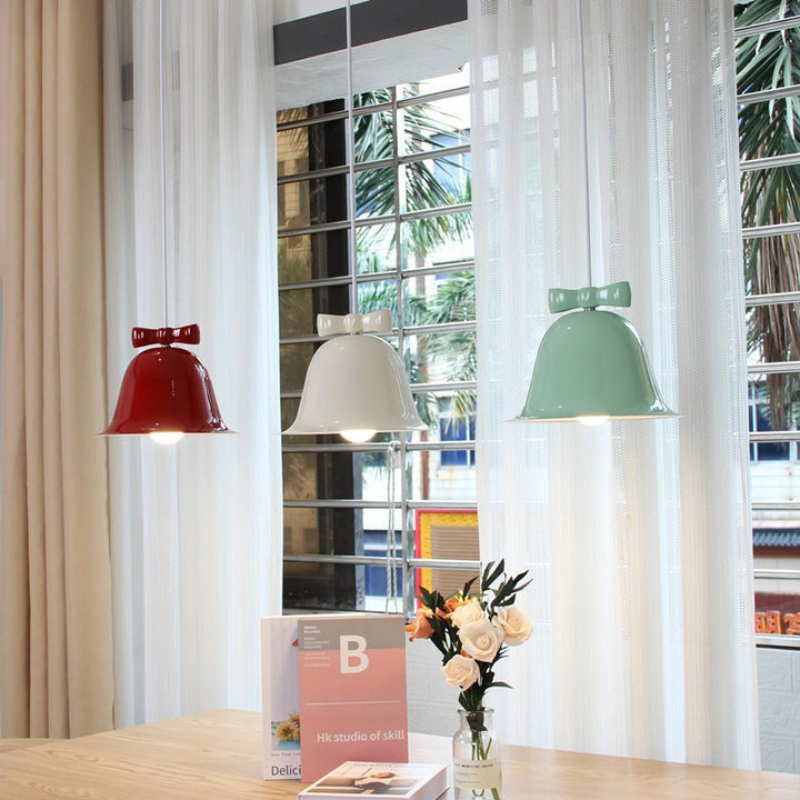 Bell-shaped glass pendant lamp with decorative bow accent