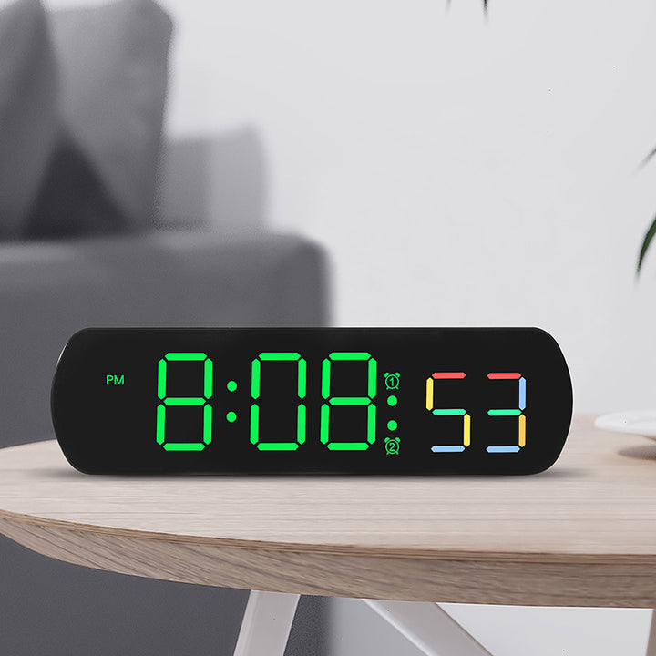 Digital radio alarm clock with multicolored LED display