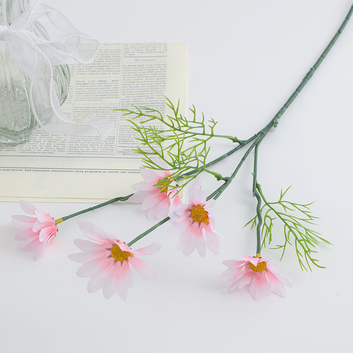 Artificial flower branch with bright blooms and delicate leaves