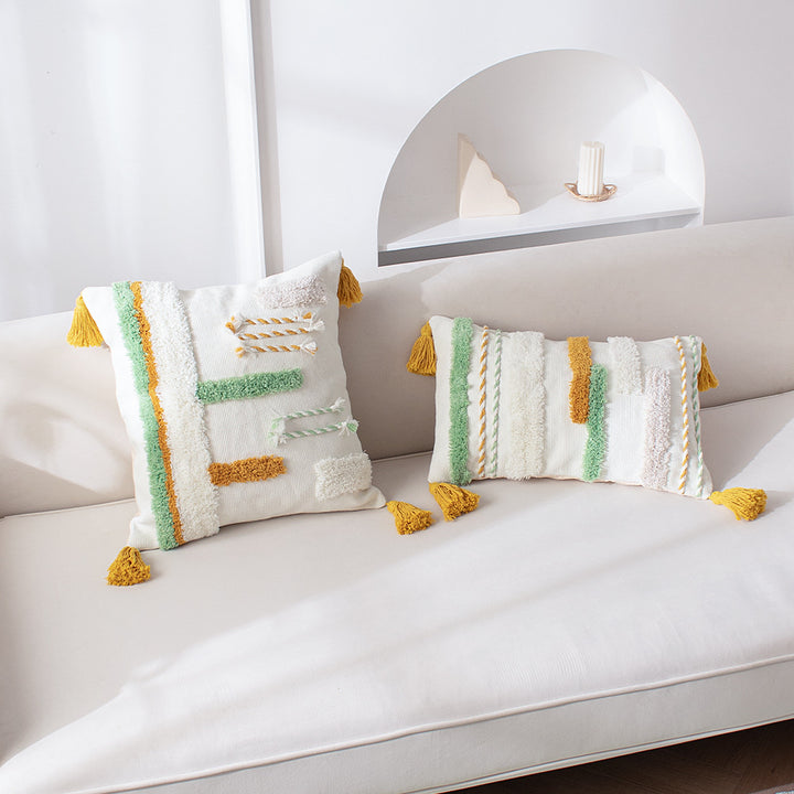 Decorative cotton cushion with hand-tufted relief and decorative tassels