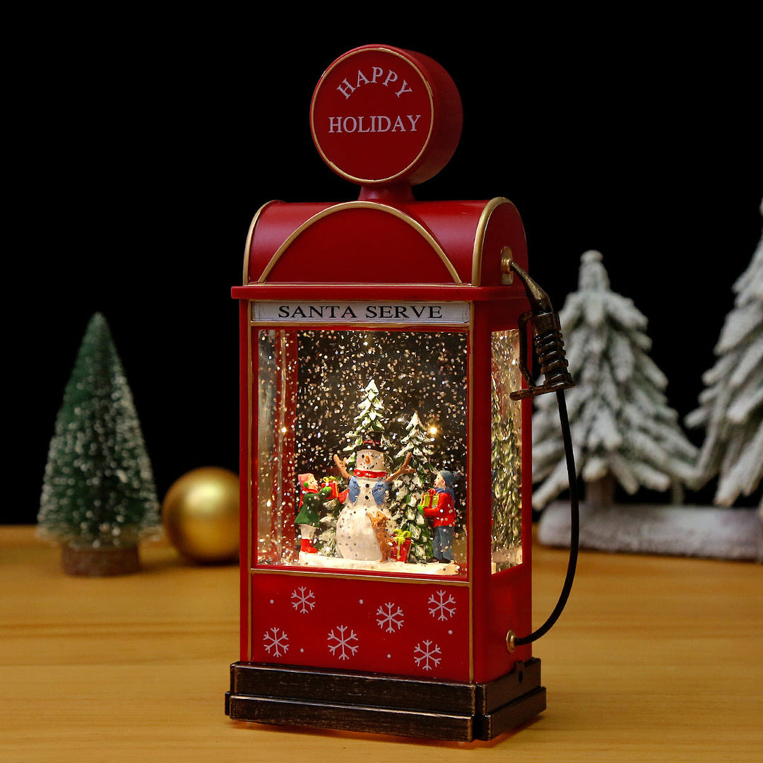 Illuminated Christmas lantern with snow and Christmas motif