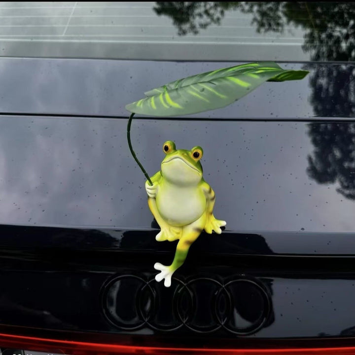 Funny frog figure with umbrella