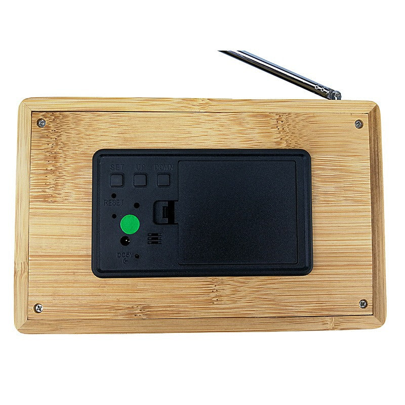 Digital radio alarm clock with temperature display