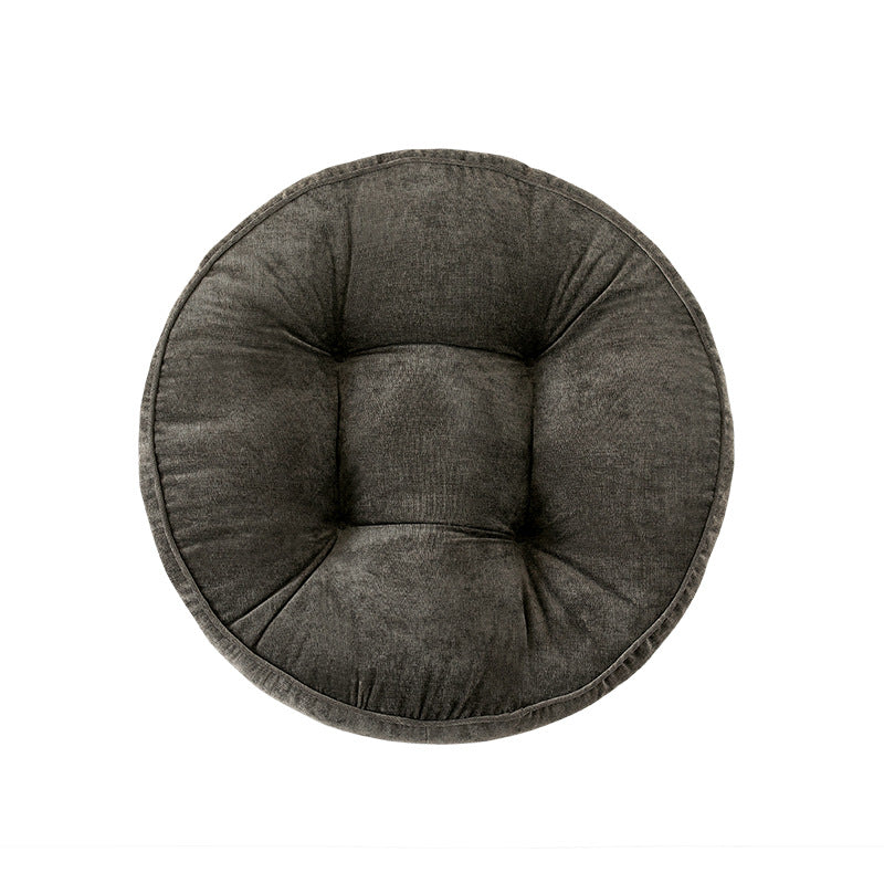 Round padded seat cushion with tufting and soft microfiber cover