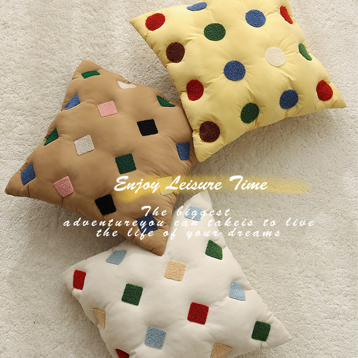 Filled decorative cushion with colorful tuft diamonds and padded structure