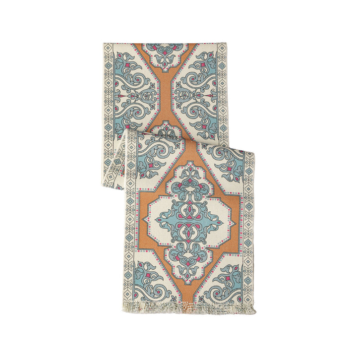 Woven table runner made of cotton blend with oriental medallion pattern and fringes