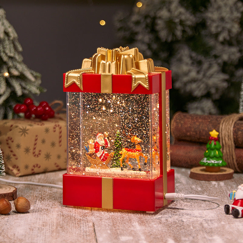 Illuminated Christmas lantern with snow and Christmas motif
