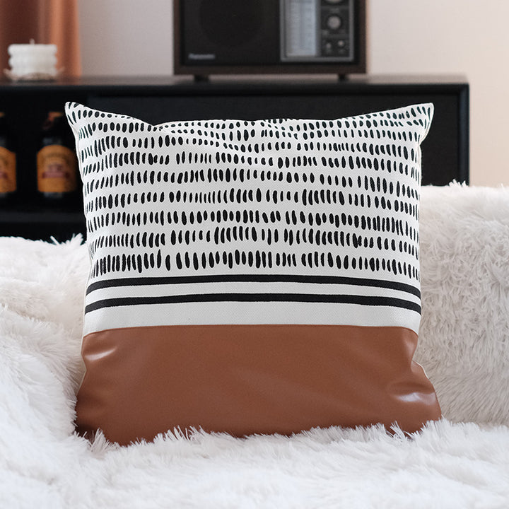 Square faux leather decorative cushion with woven central stripe and fringes