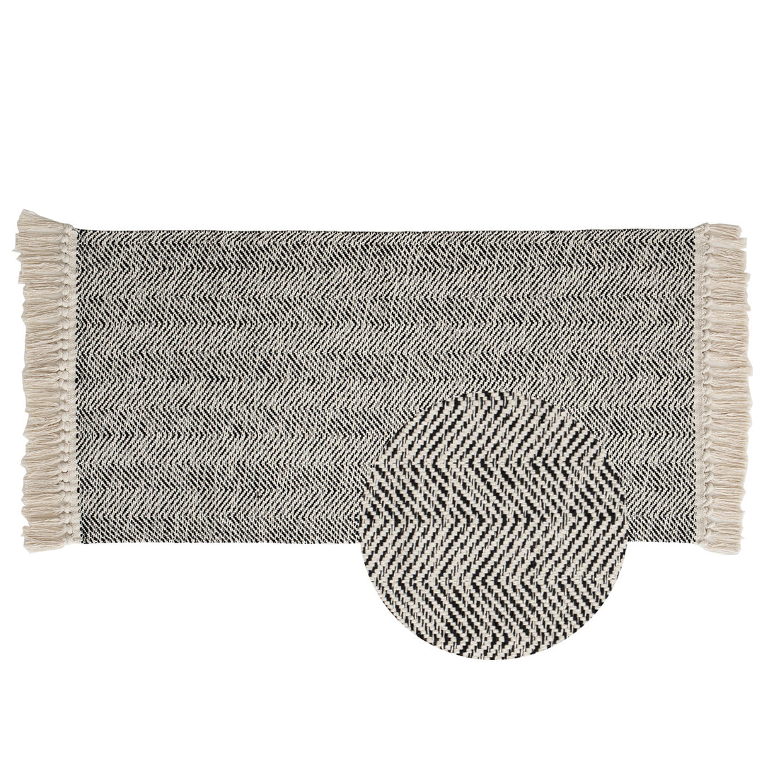 Handwoven runner rug with chevron weave and long fringes