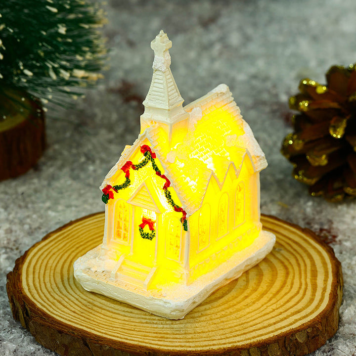 Illuminated Christmas village house with festive decoration