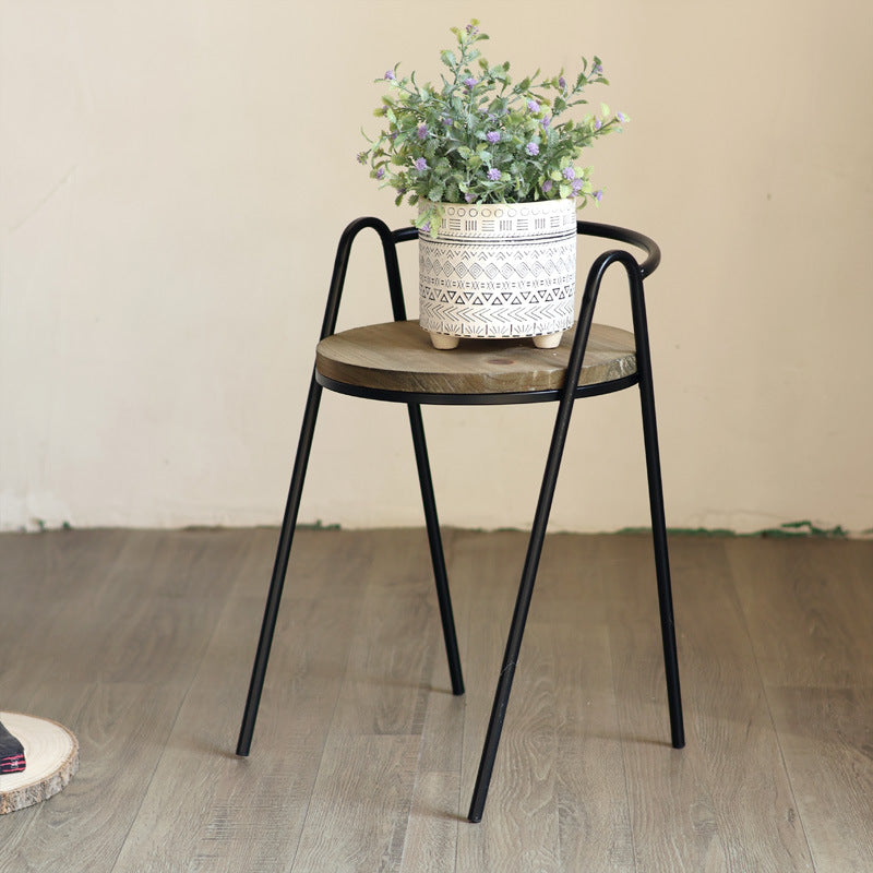 Modern stool with wooden seat and metal frame
