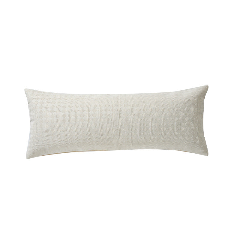 Long rectangular lumbar and neck pillow with textured woven look and concealed zipper