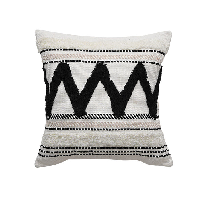 Decorative cotton cushion with pompom and woven ethnic relief