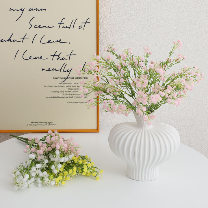 Decorative artificial flower branch with delicate purple flowers