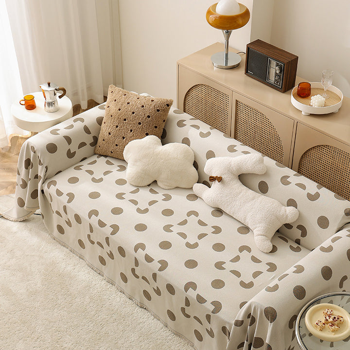 three-seater universal protective cover made of jacquard fabric with geometric pattern