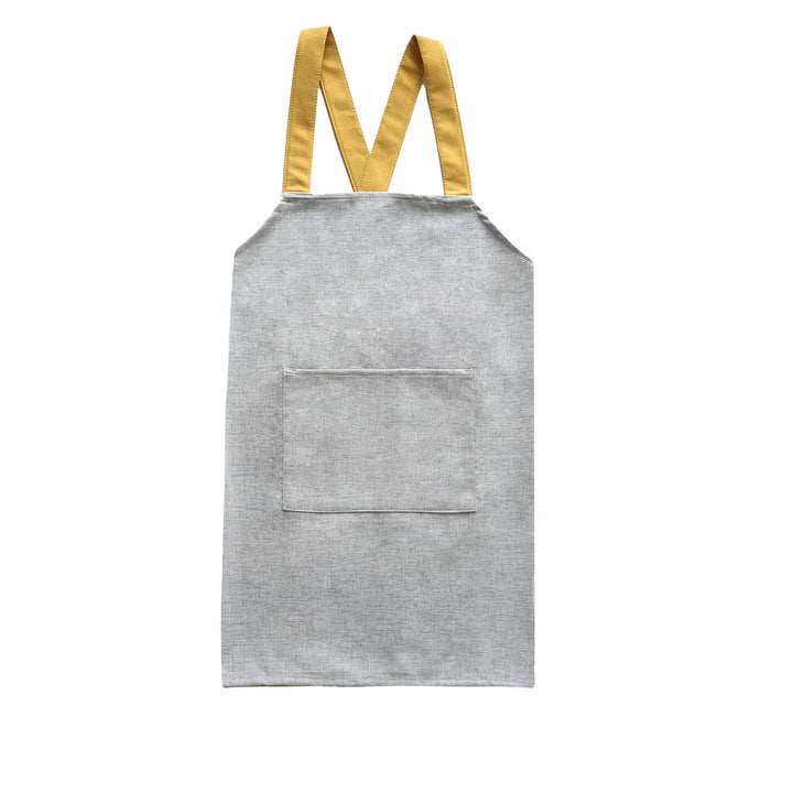 Adjustable canvas apron with wide contrast straps and applied front pocket