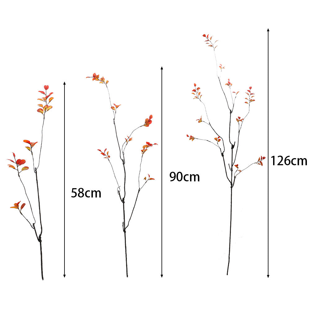 Artificial flower branch with vibrant orange flowers