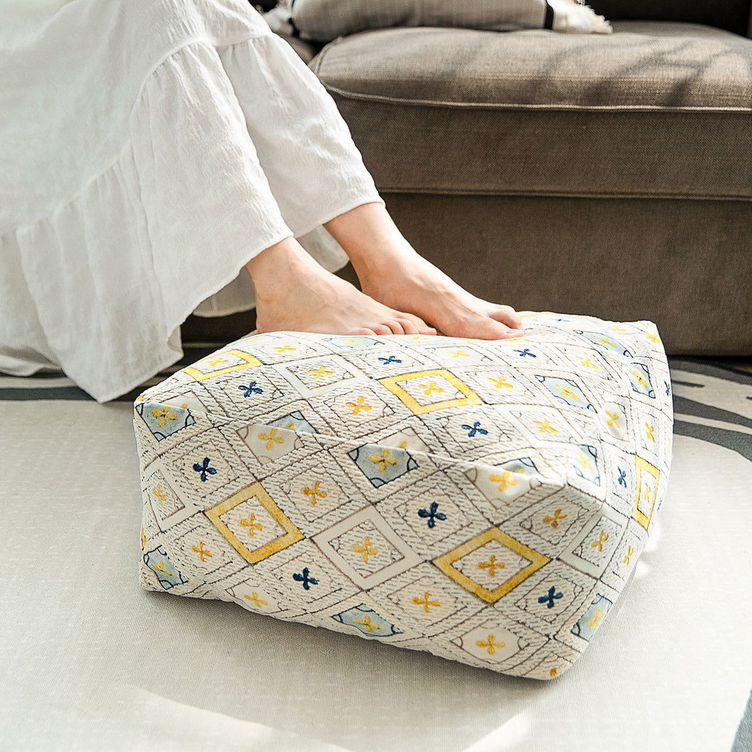 Seating pouf made of woven cotton blend with quilted diamond relief
