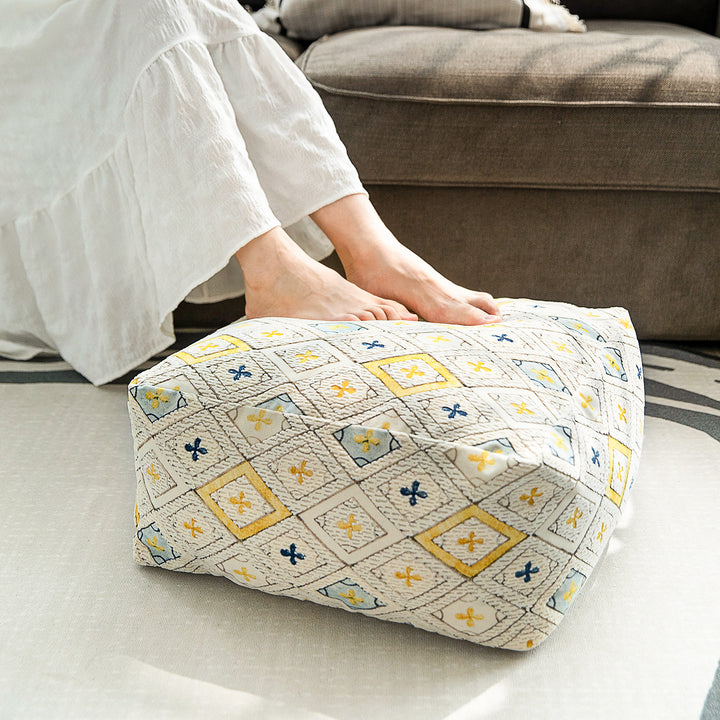 Seating pouf made of woven cotton blend with quilted diamond relief