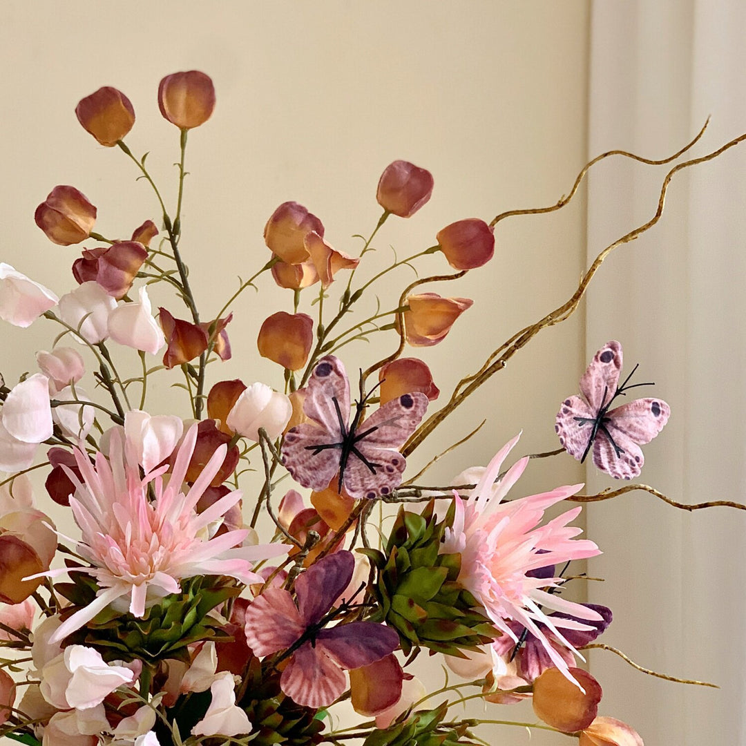 Elegant Floral Arrangement with Decorative Butterflies