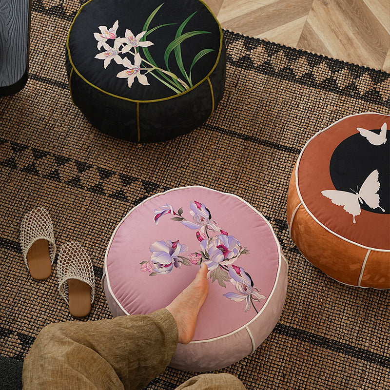round floor sitting pouf with butterfly motif and sturdy canvas cover