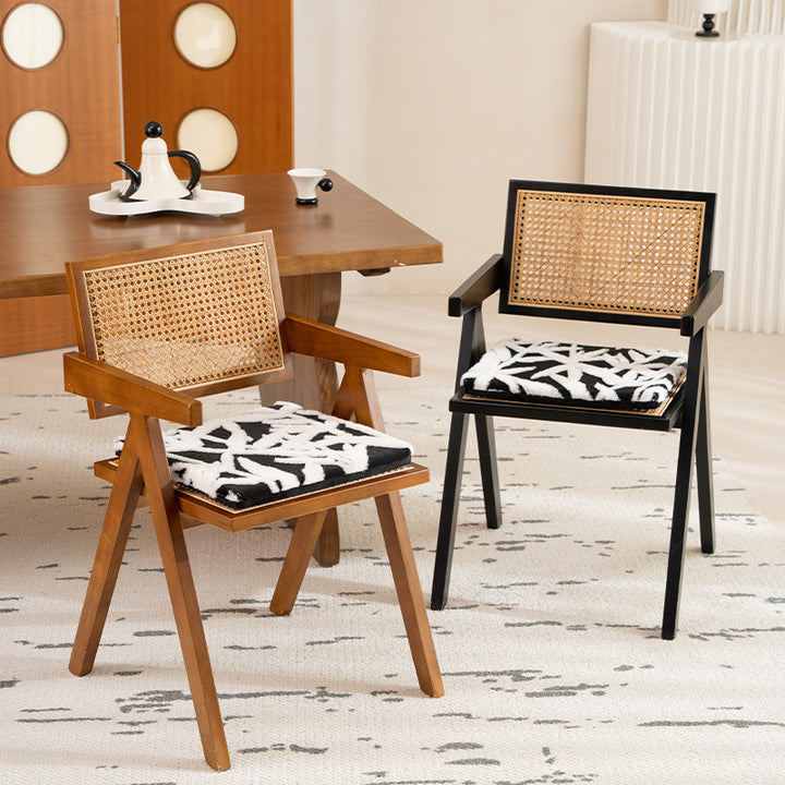 Padded seat cushion with hand-tufted leaf pattern and fastening ties
