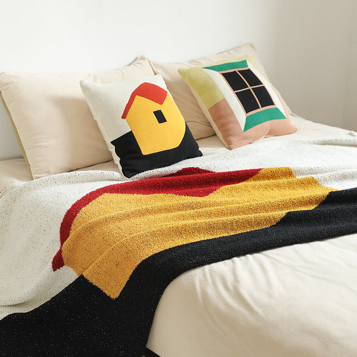 Coarsely woven decorative blanket with geometric jacquard pattern and soft bouclé