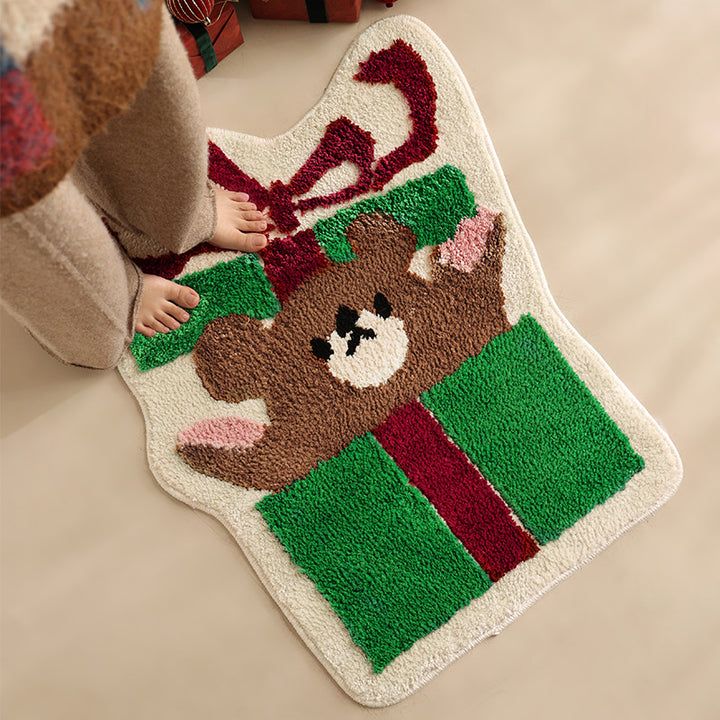 Shaped high pile bath mat with gift bear motif and non-slip backing