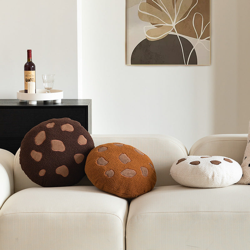 Round cuddle seat cushion with teddy fleece and abstract patch appliqués