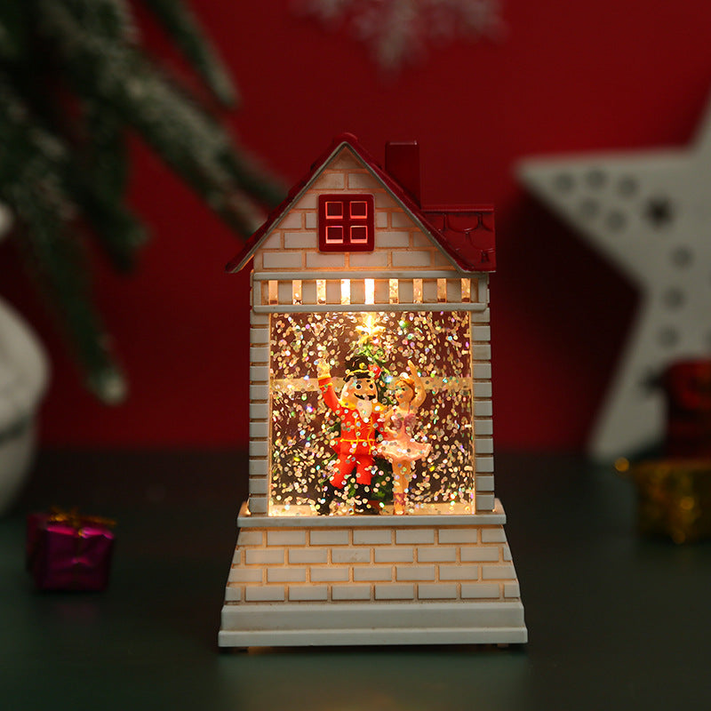 Illuminated Christmas village with moving figures