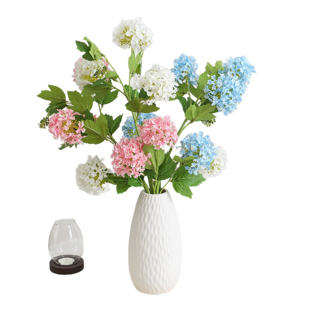 Artificial hydrangea branch with vibrant flowers and detailed leaves