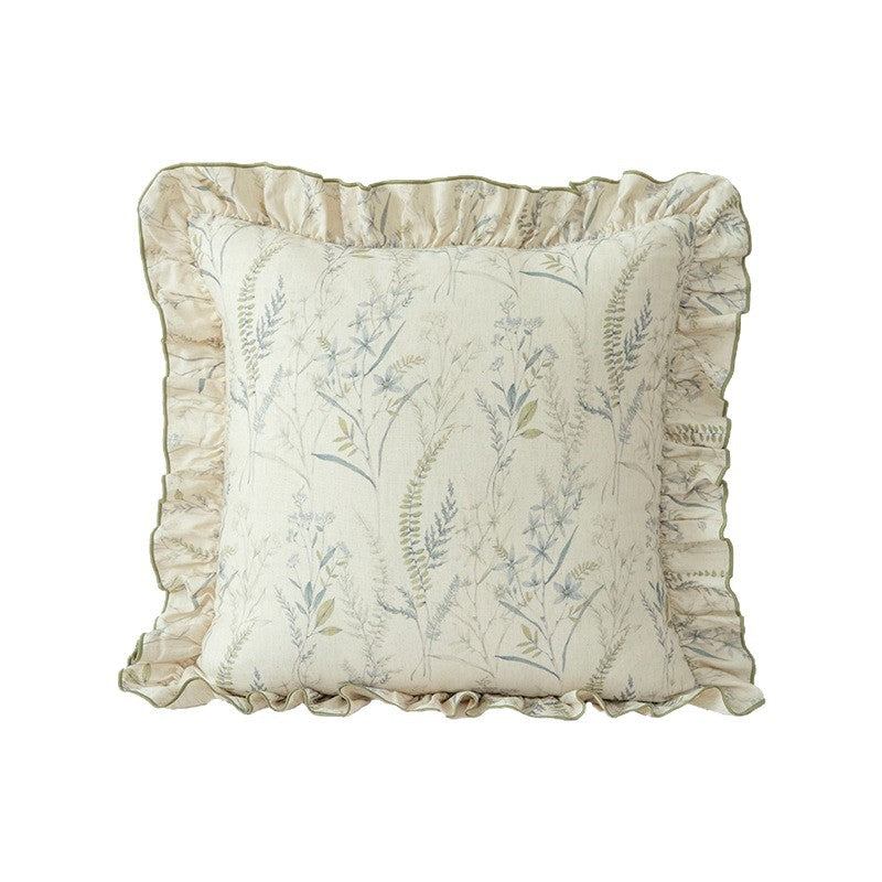 Decorative pillow with ruffles and floral linen cover