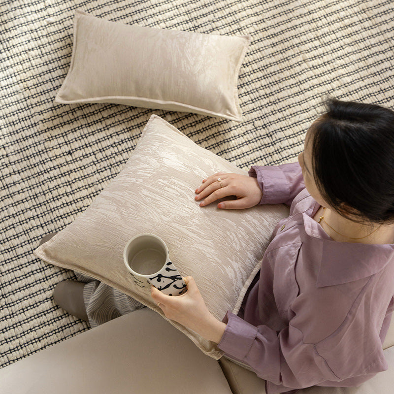 Square decorative cushion with structured Jacquard surface and piped seam