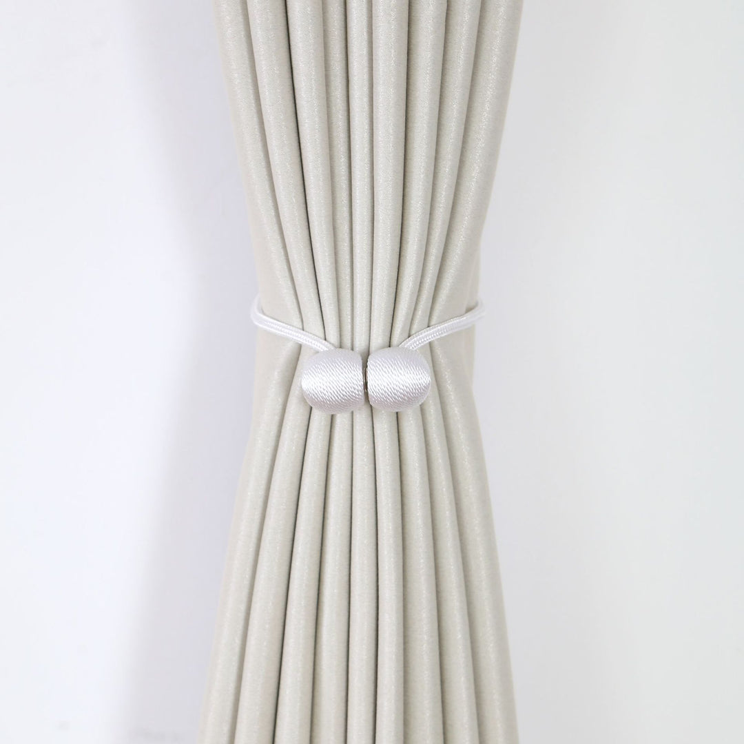Decorative curtain tieback