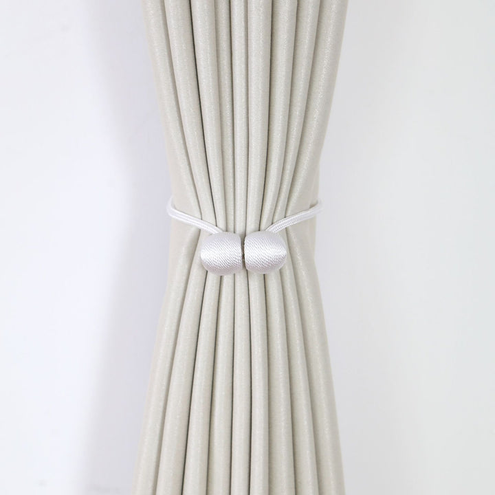 Decorative curtain tieback