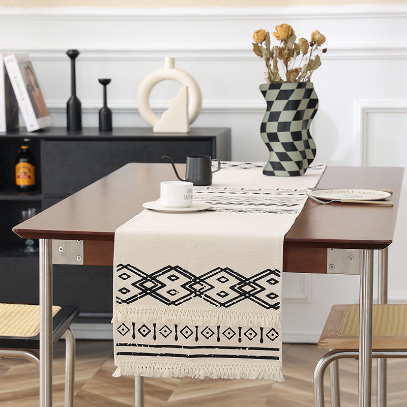 Woven table runner in Boho style with fringes and geometric ethnic print