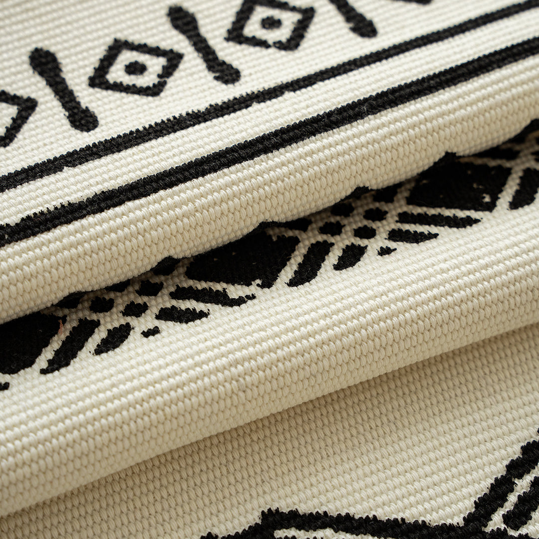 Boho table runner made of cotton blend with woven ethnic jacquard and decorative fringes