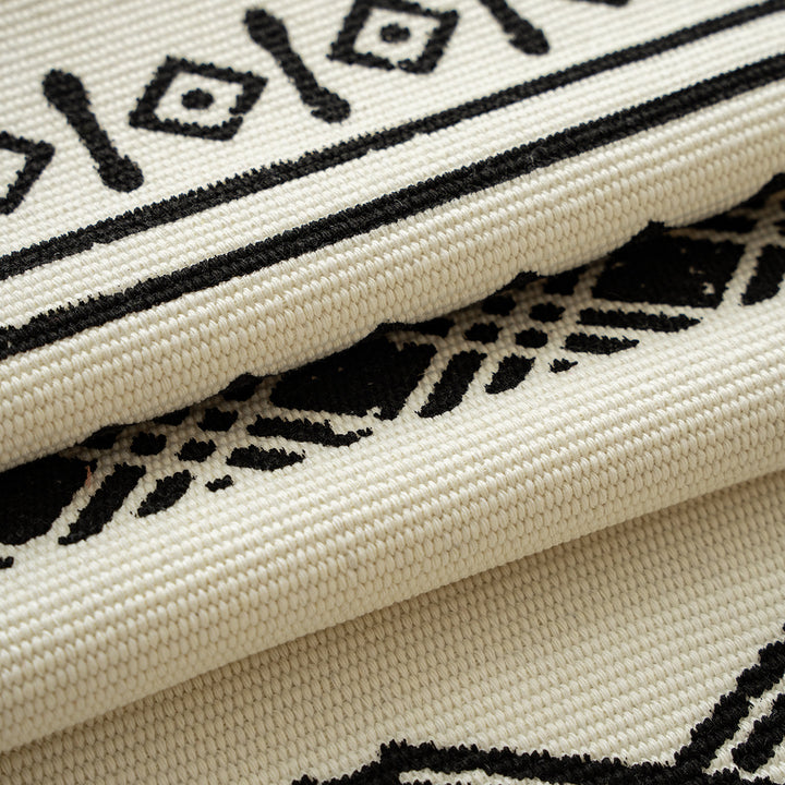 Boho table runner made of cotton blend with woven ethnic jacquard and decorative fringes