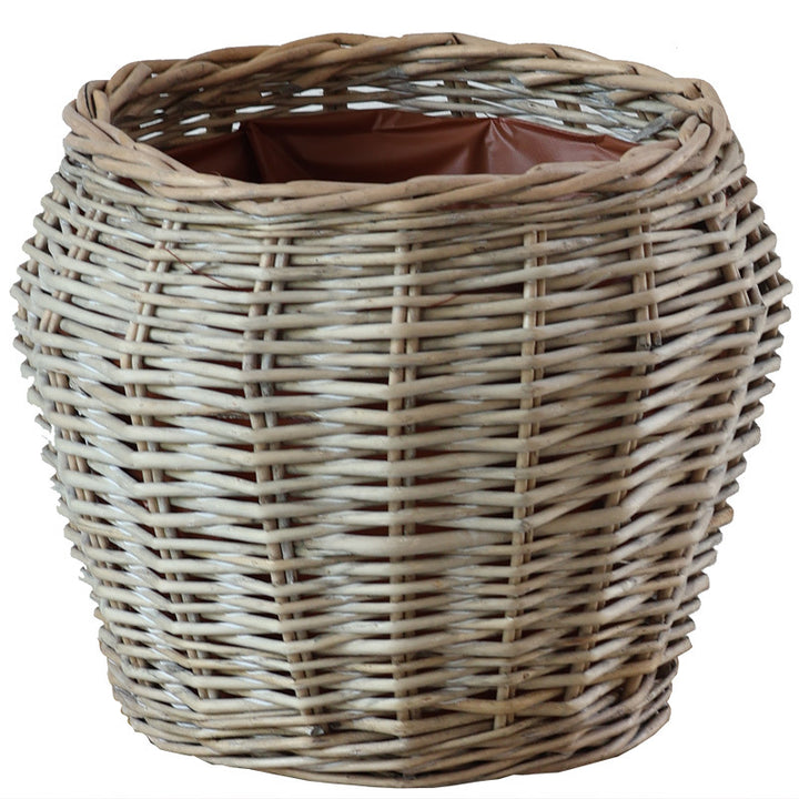 Stylish laundry basket made of braided natural material