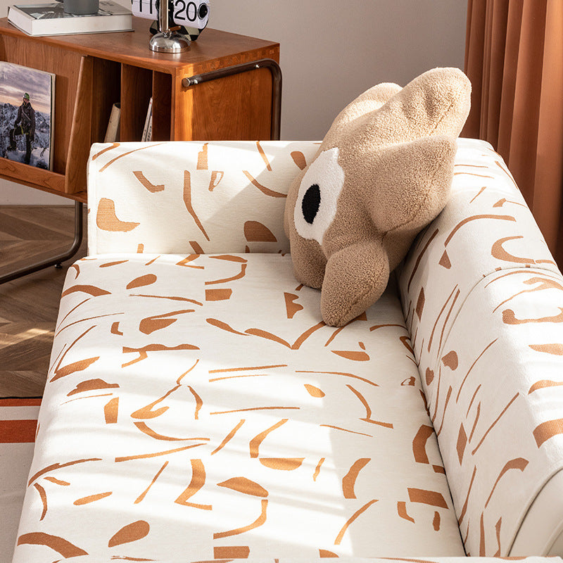 Stretch sofa cover with abstract brushstroke print and elastic waistband