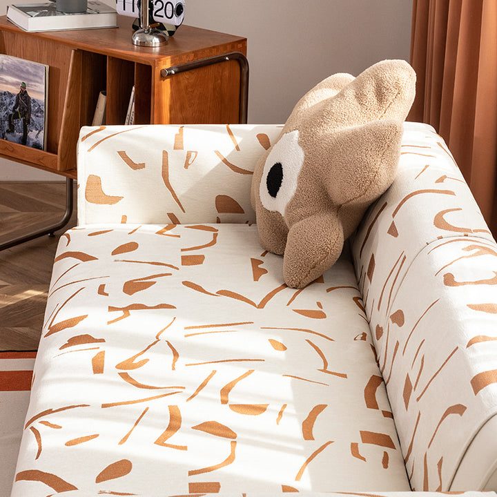 Stretch sofa cover with abstract brushstroke print and elastic waistband